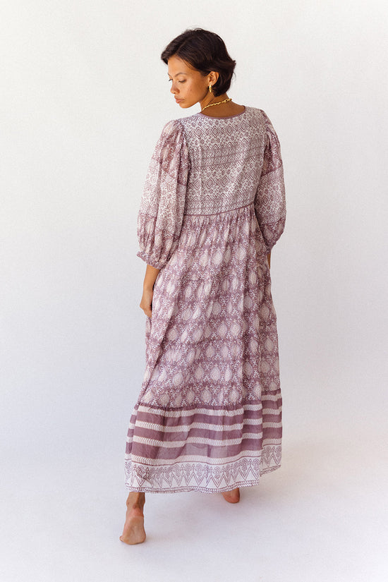 Jasmine Maxi Dress Lavender — back view full length studio, showing tiered skirt with contrast hem border, billowed sleeves, hand block print lavender cotton maxi, artisan slow fashion | Daughters of India